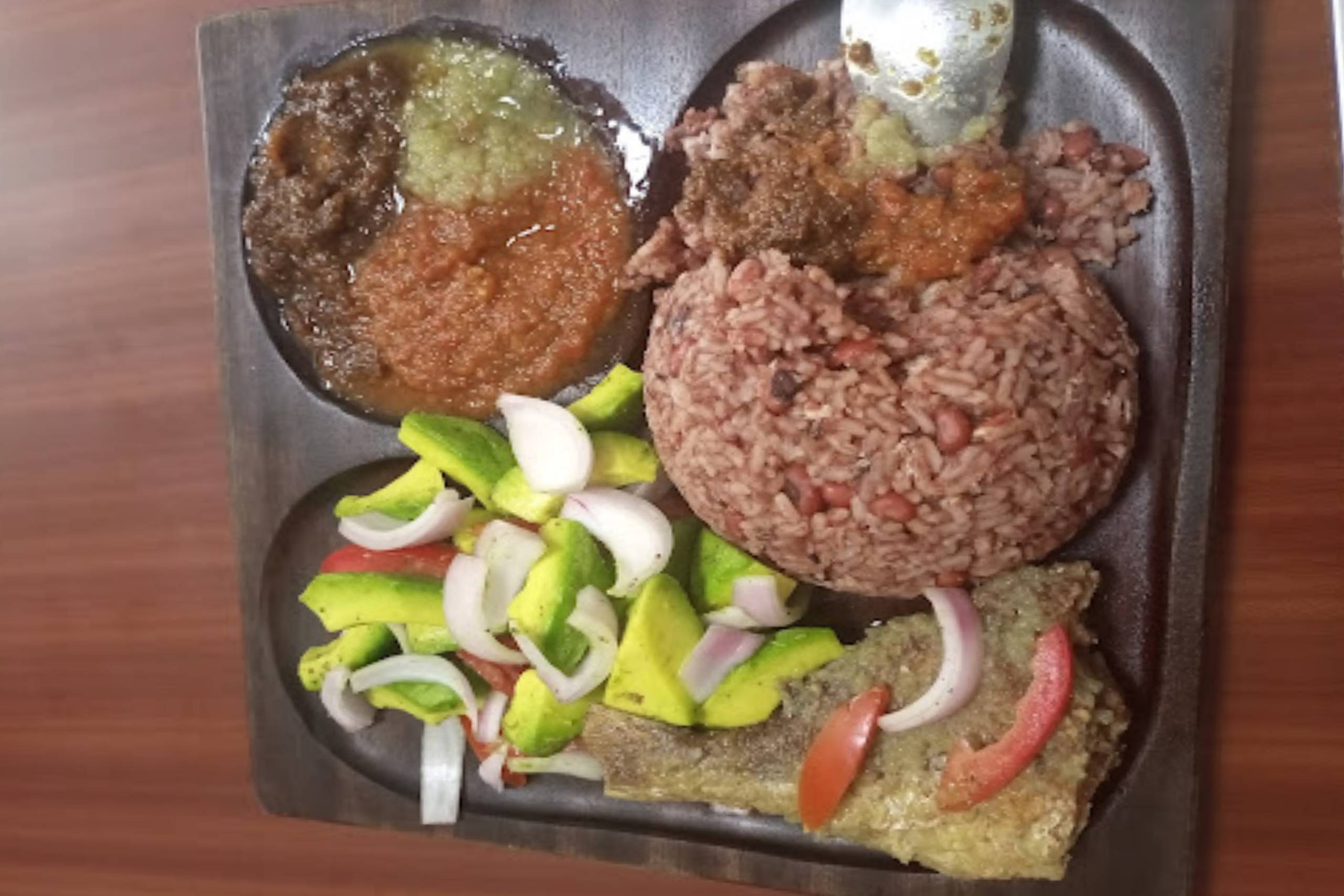 A girl is eating a taco.