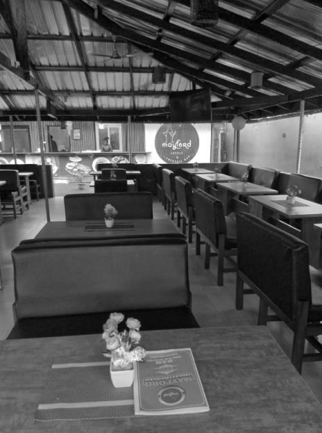 Black and white photo of American Social bar with two girls.